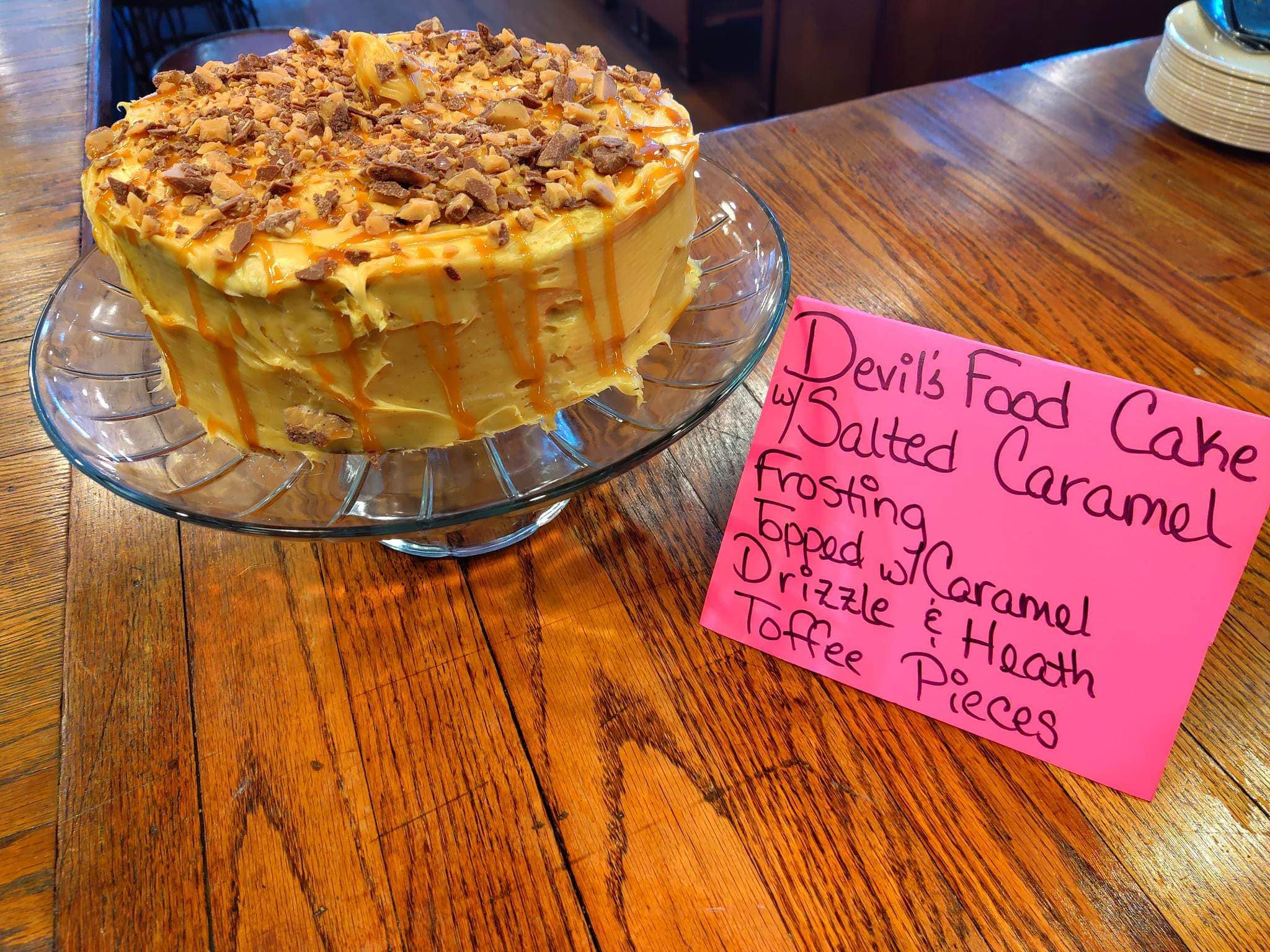 Devils Food Cake with Salted Caramel Frosting, Topped With Caramel Drizzle and Heath Toffee Pieces. A.K.A THE Tanners Cake